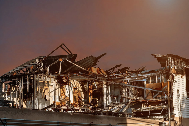 Burned home after wildfire destruction, showing need for wildfire protection system like The Wildfire Guardian™ eco-safe fire retardant.