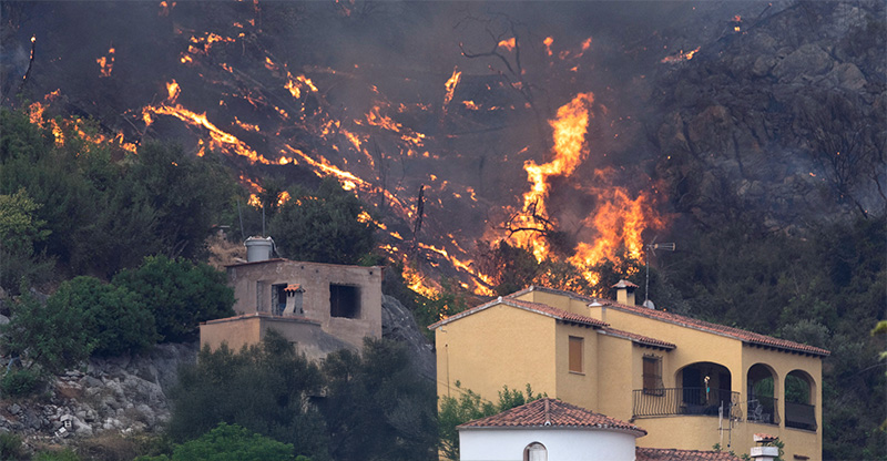 Embers from a wildfire landing on home